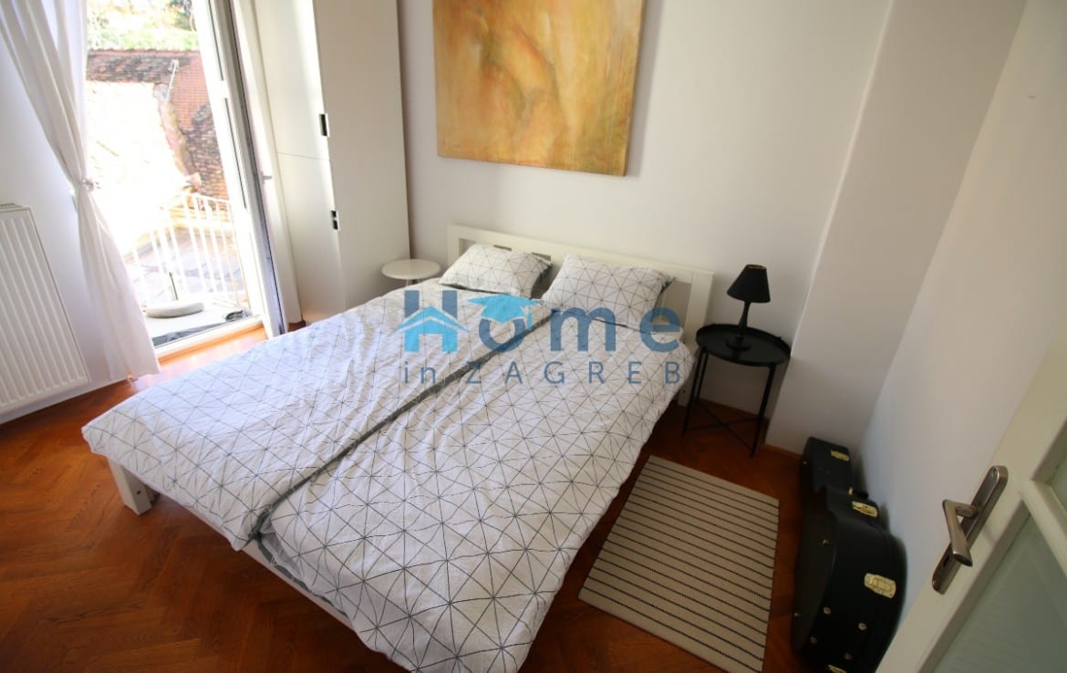 Double bed in a student apartment bedroom