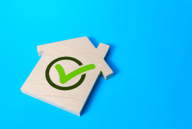 The picture shows an illustration of a house and a green tick, which indicates property verification.
